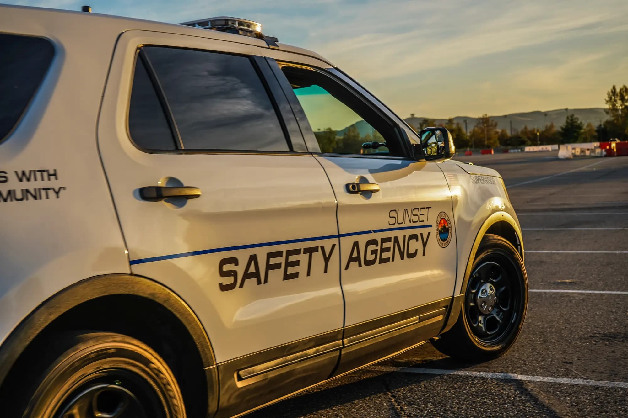 Marked Sunset Safety patrol vehicle on route to a client property